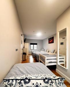 a bedroom with two beds in a room at Ambassador House in Carrick on Shannon