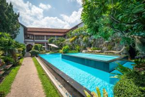 an image of a swimming pool in a villa at Kodchasri Thani Heritage Collections in Chiang Mai