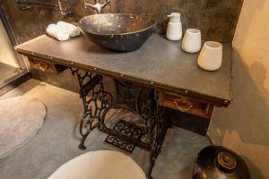 a counter with a sink and two candles on it at Pension Aperol in Hřensko +84 photos