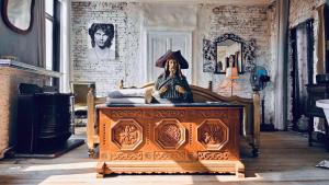 a statue sitting on top of a table in a room at Legions Retreat in Antwerp