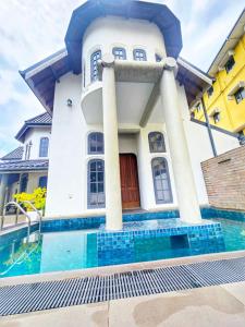 a house with a pool in front of it at Airport Luxury Villa 65 - Negombo-Airport Transit Guest in Negombo