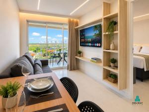 a living room with a couch and a table at Fortaleza Sul Prime By Holiday Stays in Fortaleza