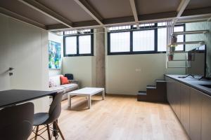 a living room with a couch and a table at Youhosty - Lambro12 in Milan