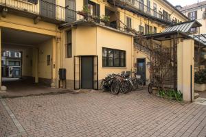 a group of bikes parked outside of a building at Youhosty - Lambro12 in Milan