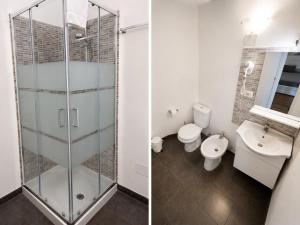 a bathroom with a glass shower and a toilet at Zurria Rooms in Catania
