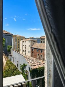 a view of a city from a balcony at Zurria Rooms in Catania