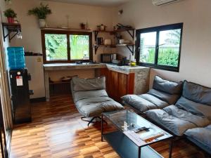 a living room with a couch and a table at Koh Tao Studios 47 in Ko Tao