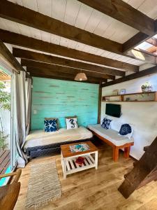 a room with a bed and a table at Posada Agua Marina in La Paloma