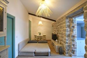 a living room with a couch and a table at Stazzo Rosalba in Arzachena