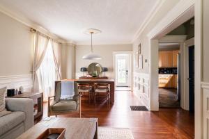 a living room with a couch and a table at Modern & Spacious 1908 Home in Stratford