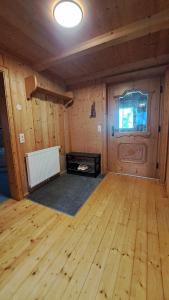 an empty room with a wooden floor and a door at Ferienhaus Berger in Virgen