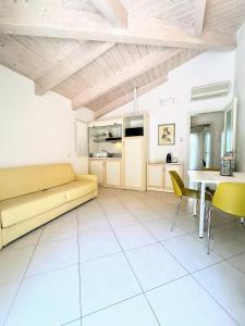 a living room with a couch and a table at Residence Suite Smeraldo in Riccione