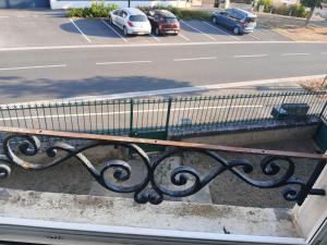 a bench sitting on the side of a street at 4-person apartment La Salamandre in Gondreville