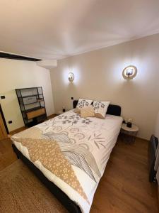 a bedroom with a large bed in a room at Villa du Parc le Lilas in Formiguères +27 photos