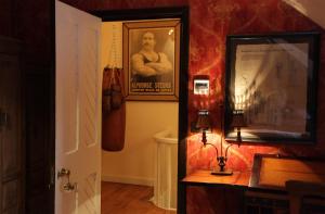 a hallway with a picture of a man on the wall at Old England House in Minas de Ríotinto +24 photos