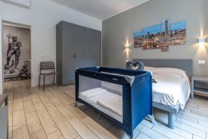 a small bedroom with a blue bunk bed at Sun Bologna in Bologna