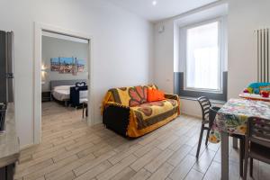 a bedroom with a bed and a dining table at Sun Bologna in Bologna