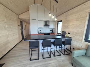 a kitchen with a island in the middle of a room at Eifelchalet Mendig in Mendig
