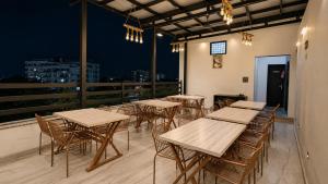 a row of tables and chairs on a balcony at Hotel Jewels at Rajpur Road in Dehradun