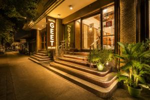 a store front with some plants in front of it at Hotel Geet Deluxe Near Connaught Place and New Delhi Railway Station in New Delhi