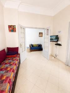 a large living room with a couch and a couch at Cosy Art Deco Apart Welcome to James's in Casablanca +24 photos