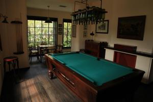 a living room with a pool table in it at Old England House in Minas de Ríotinto