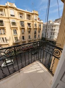 a balcony with a view of a building at Cosy Art Deco Apart Welcome to James's in Casablanca