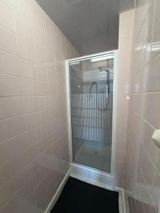 a shower with a glass door in a bathroom at The Jack Sparrow Hotel in Blackpool