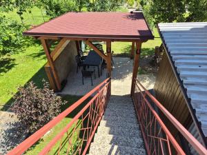 a gazebo with two chairs and a table at Ubytování Šustovka in Třeboň
