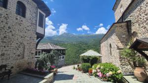a view from the courtyard of a building with flowers at Panorama Apartment in Mavrovo