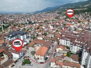 an aerial view of a city with two signs at Nuvelle Boutique Hotel in Prizren