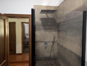 a shower in a bathroom with a wall at Appartamento 3 in Viareggio +36 photos