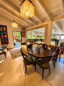 a dining room with a table and chairs at 3 Bedroom Villa with Pool and Ocean Views in Cap Estate