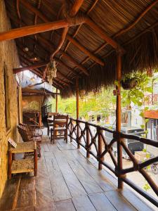 a porch of a resort with a table and chairs at Hotel Artesanal Palomera in San Francisco
