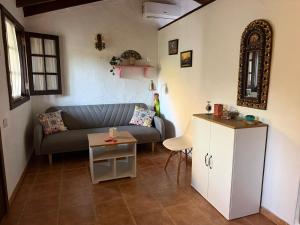 a living room with a couch and a table at Finca Nim 1 in Mogán