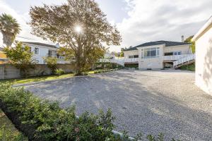 an empty driveway in front of a house at Lagoon View Cottage in Knysna