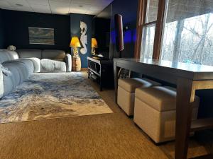 a living room with a bed and a table and chairs at TnTBnB in Combined Locks