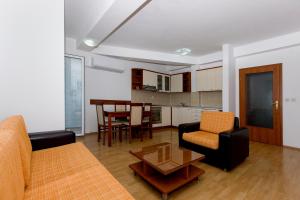a living room with a couch and a table at Nikola Apartments in Ohrid