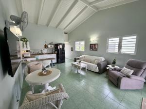 a living room with a couch and a table at Lagoon Ocean Resort 2 bdrm/2bath with beach access in Lagun