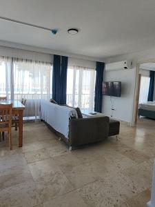 a living room with a bed and a couch at Ilya Apart 1 in Bodrum City