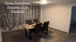 a conference room with a wooden table and chairs at Balilounge 1 & Balilounge 2 in Haßloch +27 photos