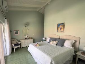 a bedroom with a bed with a dog laying on it at Lagoon Ocean Resort 2 bdrm/2bath with beach access in Lagun +27 photos
