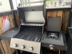 an outdoor grill with a stove on a balcony at 4 star holiday home in SÖLVESBORG in Sölvesborg
