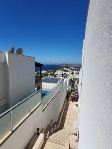 a balcony of a building with a view of a city at Ilya Apart 1 in Bodrum City
