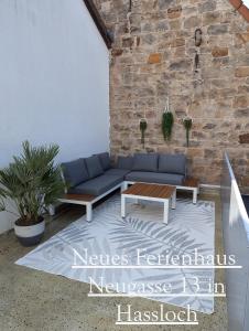 a living room with a couch and a coffee table at Balilounge 1 & Balilounge 2 in Haßloch