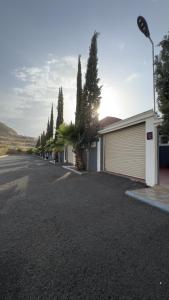a driveway of a house with a garage at منتجع وفلل المرفأ ابها in Abha