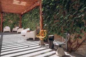 a group of chairs and tables on a patio at Revelton Ostrava in Ostrava +28 photos