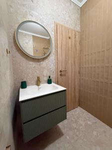 a bathroom with a sink and a mirror at Studio Allure 2 in Kornić +12 photos