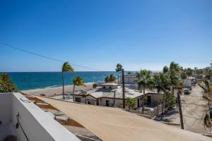 a view of the beach from the balcony of a house at Ocean View Studio Near Los Barriles in Buenavista