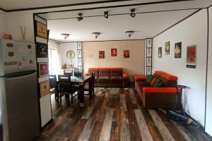 a living room with a couch and a table at CASA de VIS in Sinaia